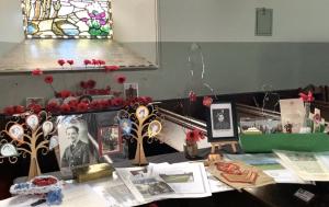 Memory boxes at War Memorial window 